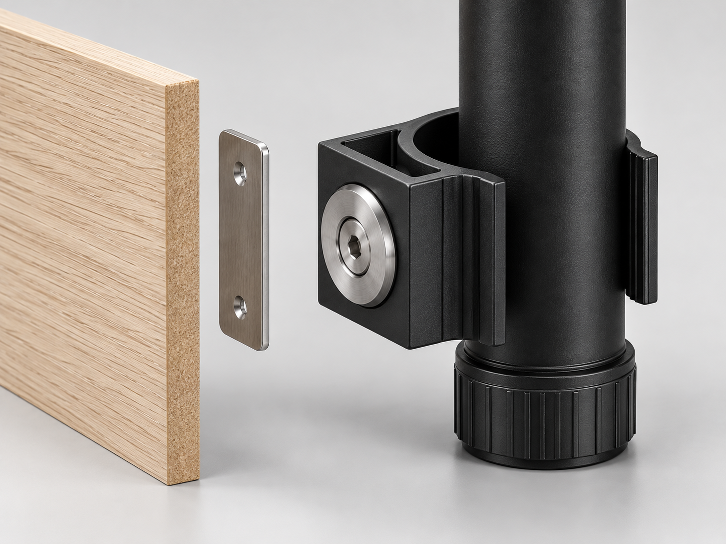 Exploded concept render showing the leg-mounted magnet aligned with a steel mating plate on the back of an oak kickboard